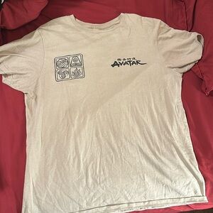 Crew neck. Short sleeve Beige Avatar Tee shirt. In size Medium